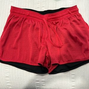 Champion women’s reversible athletic shorts - red & black. size M